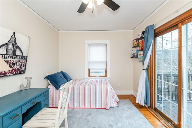 bedroom with access to exterior, wood-type flooring, ceiling fan, and crown molding