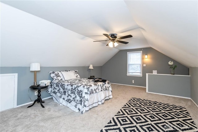 carpeted bedroom featuring ceiling fan and lofted ceiling