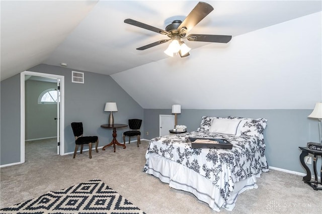 carpeted bedroom featuring ceiling fan and vaulted ceiling