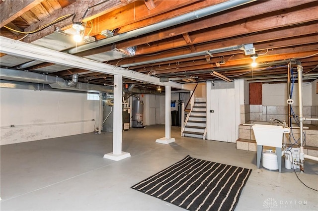 basement featuring gas water heater