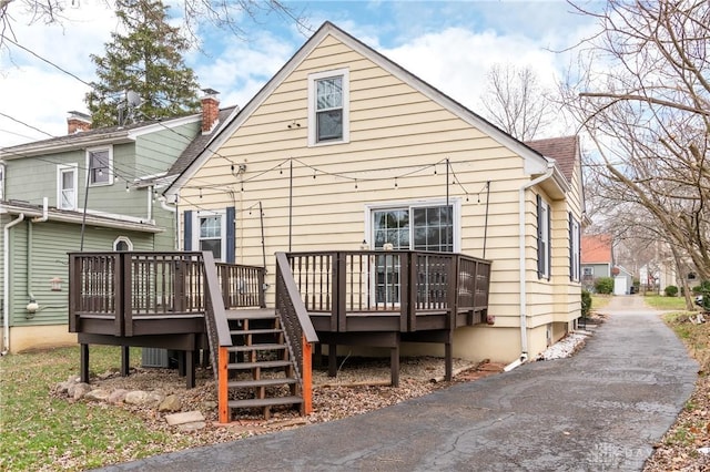 rear view of house with a deck