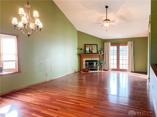 unfurnished living room featuring lofted ceiling, wood-type flooring, and a high end fireplace