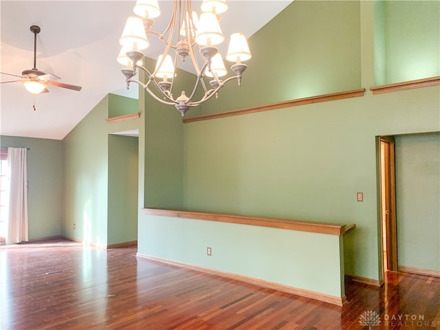 unfurnished room featuring high vaulted ceiling, wood-type flooring, and ceiling fan with notable chandelier