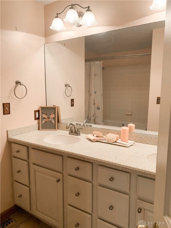 bathroom with tile patterned floors and vanity