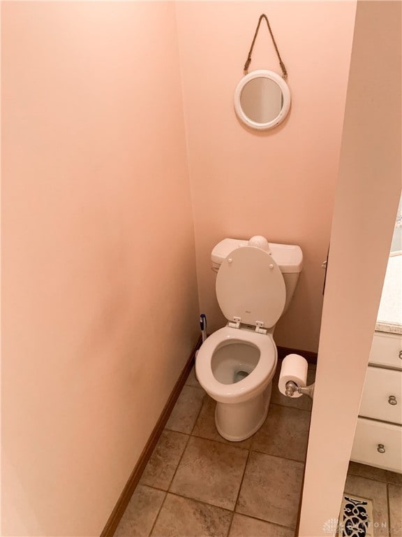 bathroom featuring tile patterned flooring and toilet