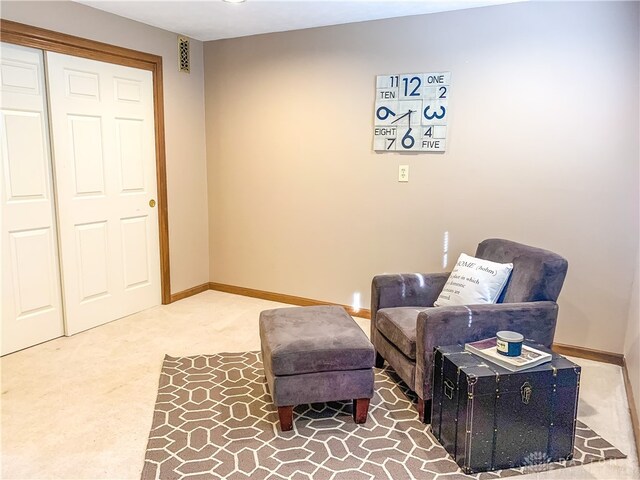 sitting room featuring carpet flooring