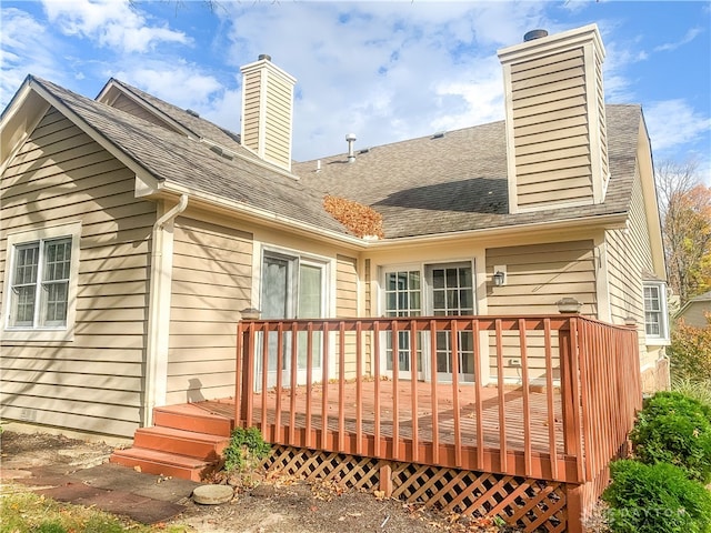 rear view of house featuring a deck