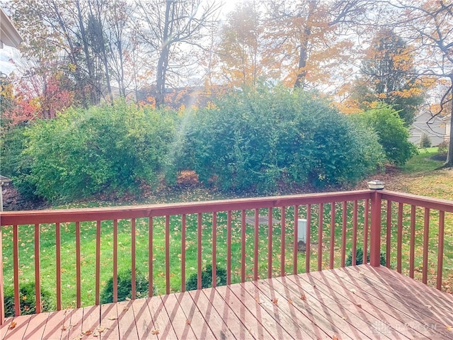 wooden terrace with a yard