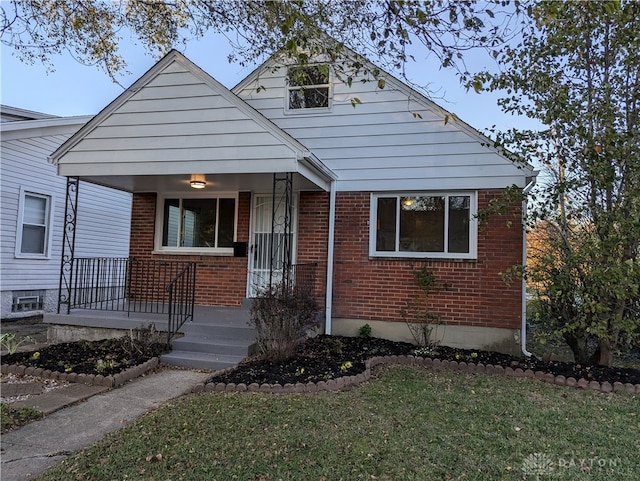 bungalow-style house featuring a front yard and a porch