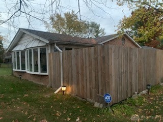 view of outdoor structure with a lawn