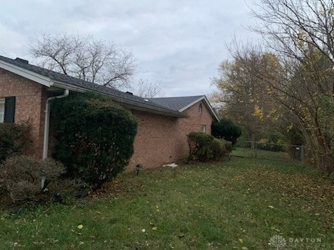 view of side of property featuring a yard