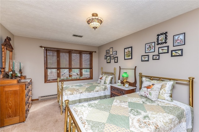 carpeted bedroom with a textured ceiling and a baseboard radiator