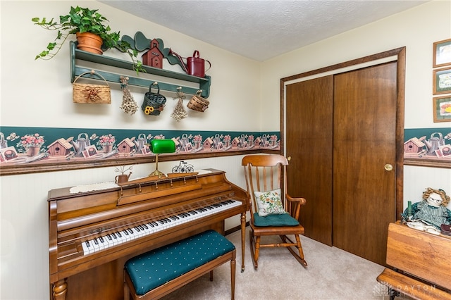 misc room with carpet, a textured ceiling, and wooden walls