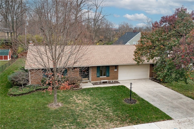 view of front of home featuring a garage and a front lawn