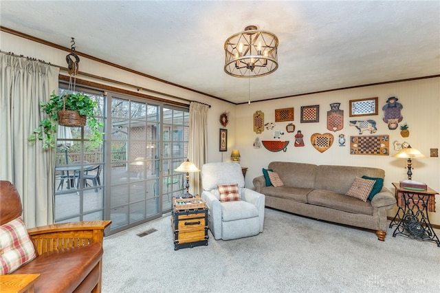 living room featuring carpet flooring, ornamental molding, a textured ceiling, and a notable chandelier