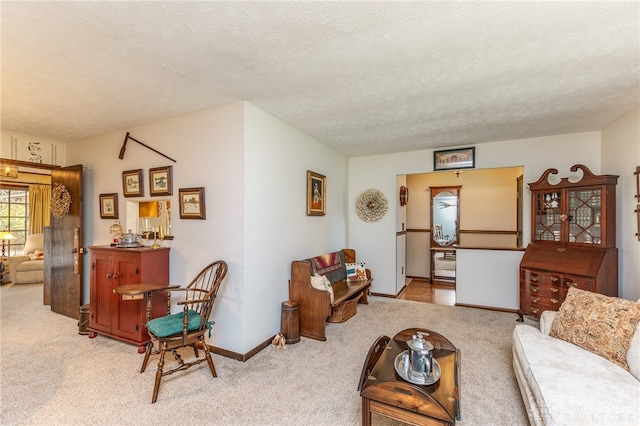 carpeted living room with a textured ceiling