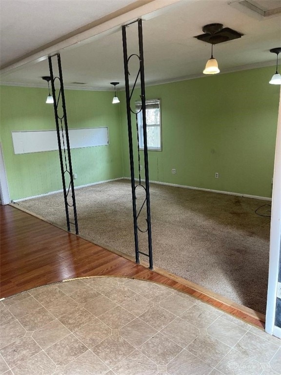 interior space featuring crown molding and light hardwood / wood-style flooring