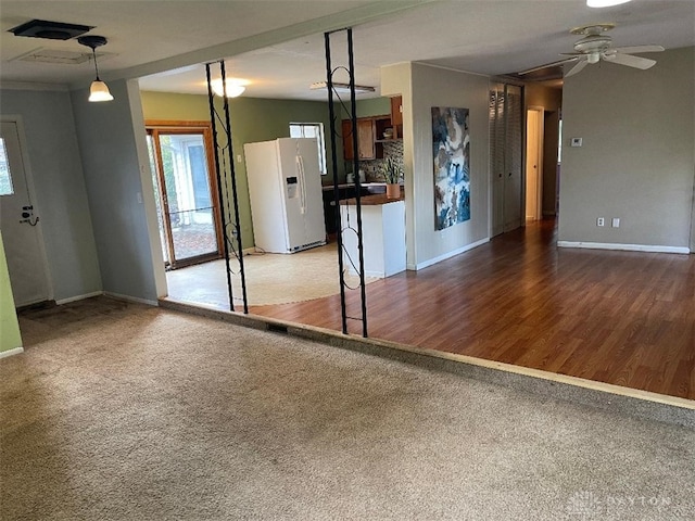 interior space featuring dark hardwood / wood-style flooring and ceiling fan