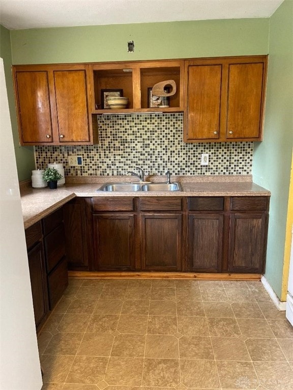 kitchen featuring sink and backsplash