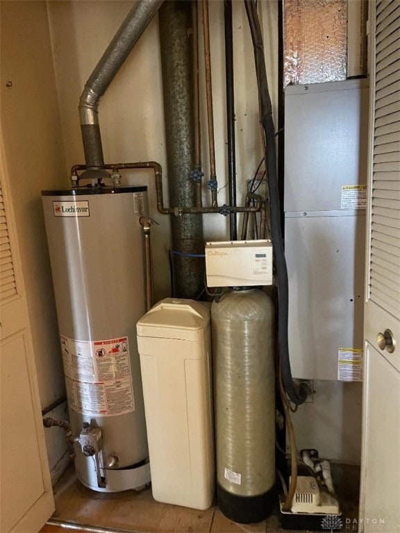 utility room with gas water heater