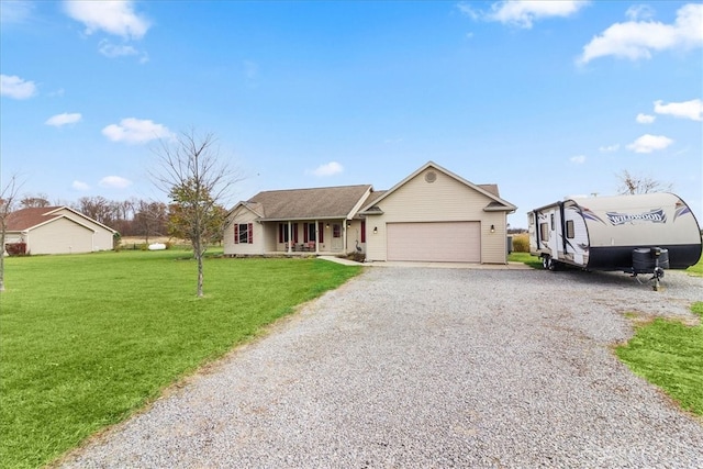 ranch-style home with covered porch, a garage, and a front lawn