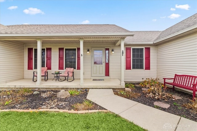 doorway to property featuring covered porch