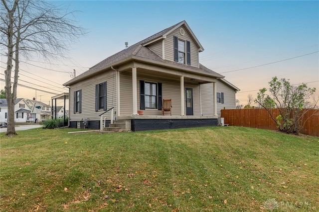 exterior space featuring a lawn and a porch