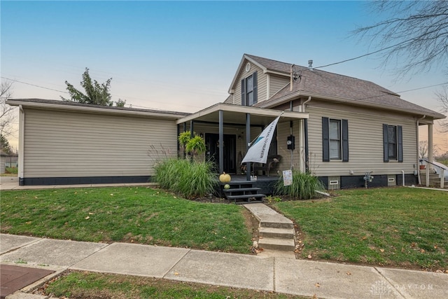 view of front of house with a porch and a front yard