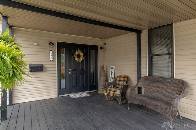 entrance to property featuring a porch