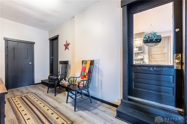 foyer entrance with hardwood / wood-style floors