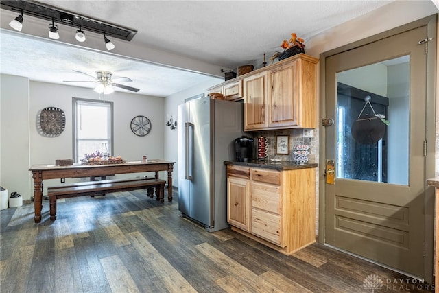 kitchen with ceiling fan, light brown cabinets, dark wood-type flooring, and a textured ceiling