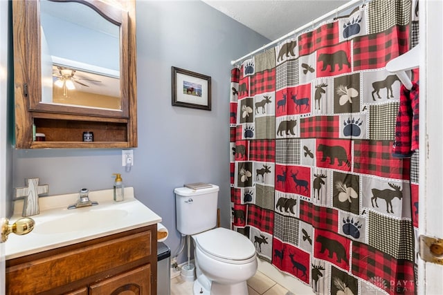 bathroom featuring curtained shower, tile patterned floors, a textured ceiling, toilet, and vanity