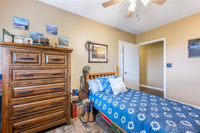 bedroom featuring ceiling fan and hardwood / wood-style floors