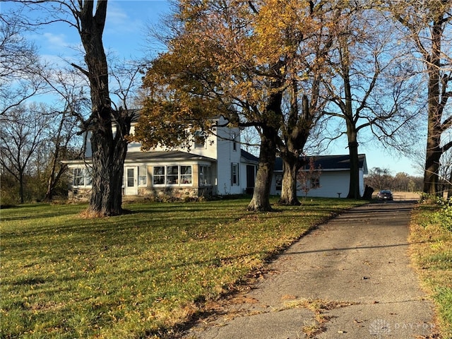 ranch-style home with a front lawn