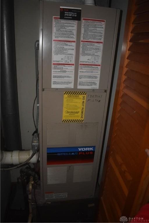 utility room with heating unit