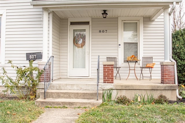 property entrance featuring covered porch