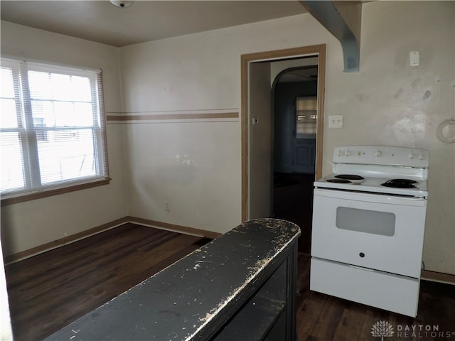 kitchen with white range with electric stovetop and dark hardwood / wood-style floors