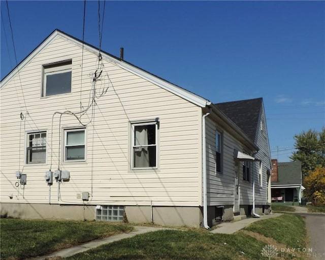 view of home's exterior featuring a yard