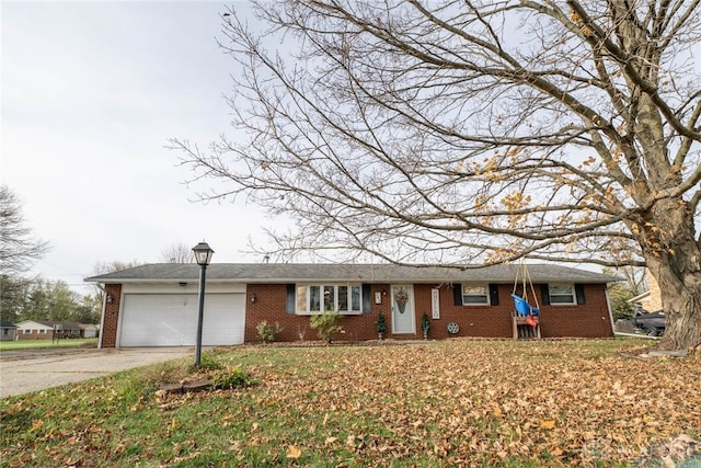 ranch-style house featuring a garage