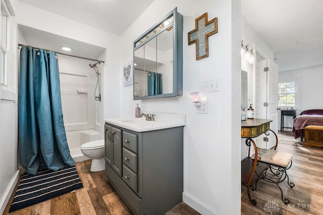 full bathroom with vanity, shower / bath combination with curtain, toilet, and wood-type flooring