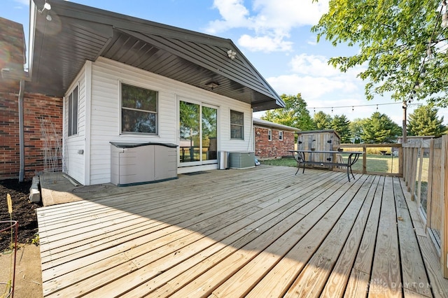 wooden terrace with a storage unit