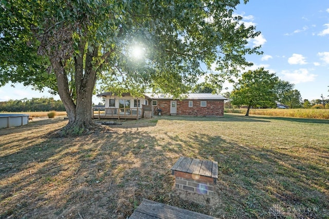 view of yard with a wooden deck