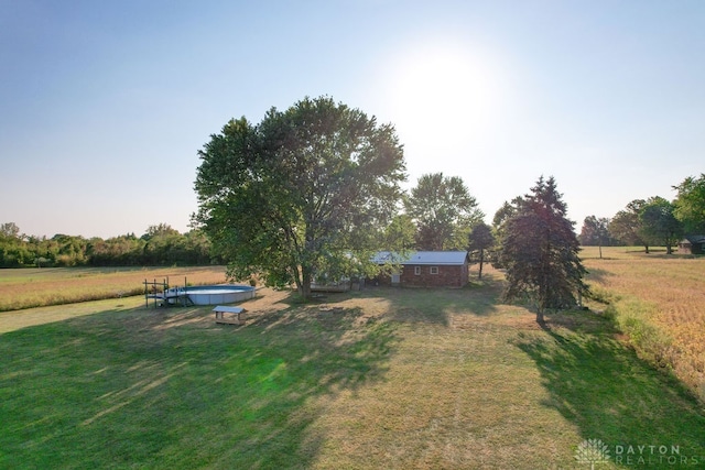 view of yard with a rural view