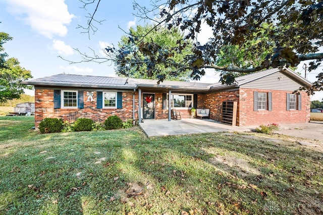 ranch-style home with a patio area and a front lawn