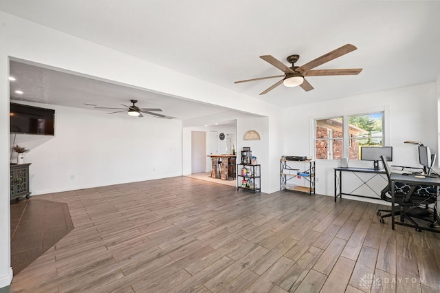 interior space with hardwood / wood-style flooring and ceiling fan