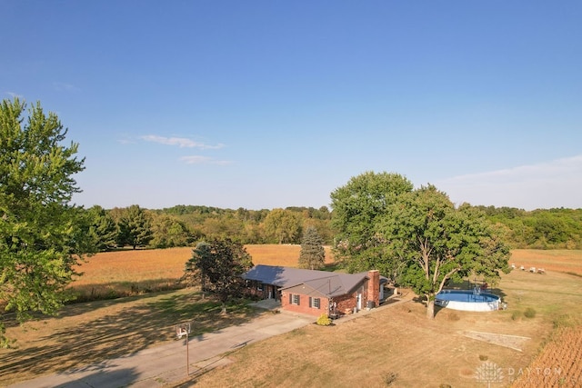 birds eye view of property featuring a rural view