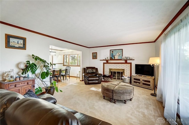 carpeted living room with a fireplace and crown molding