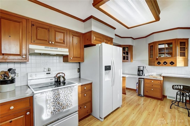 kitchen featuring tasteful backsplash, electric stove, white fridge with ice dispenser, and light hardwood / wood-style flooring