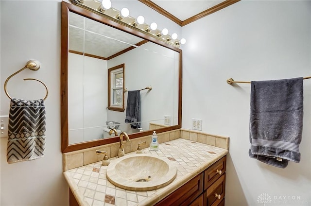 bathroom featuring vanity and ornamental molding