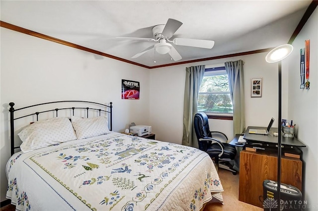 carpeted bedroom featuring ceiling fan and ornamental molding